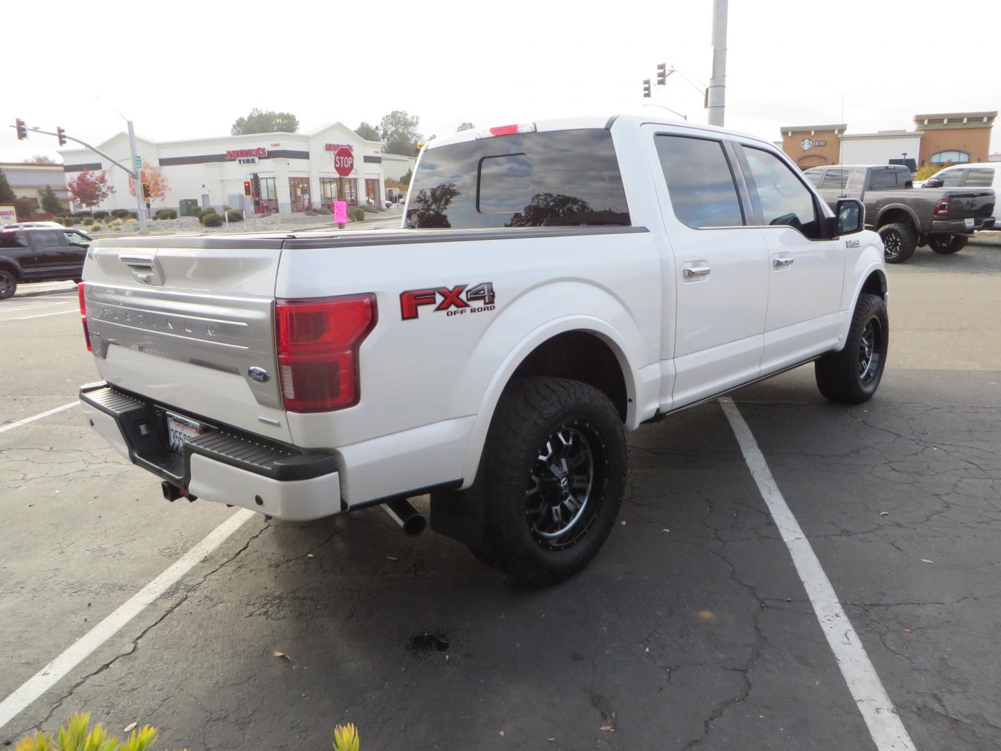 2019 White /BLACK INT W/DARK MARSALA LT Ford F-150 Platinum SuperCrew Cab 4WD (1FTEW1E45KF) with an 3.5L V6 ECOBOOST engine, 10-SPEED AUTO W/TOW MO transmission, located at 2630 Grass Valley Highway, Auburn, CA, 95603, (530) 508-5100, 38.937893, -121.095482 - F150 Platinum featuring a level kit, Fuel Offroad wheels, Toyo AT2 tires, Barricade Front winch bumper, Smittybilt winch, LED light bar, Undercover Ultraflex bedcover, and a Cargo Glide bed system. - Photo#4